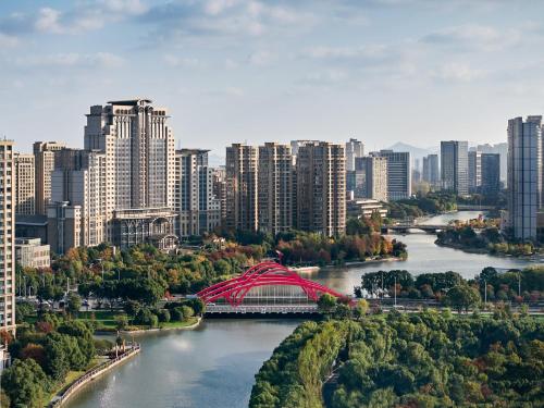 a city with a bridge in the middle of a river at The Azure Ningbo, Vignette Collection in Ningbo