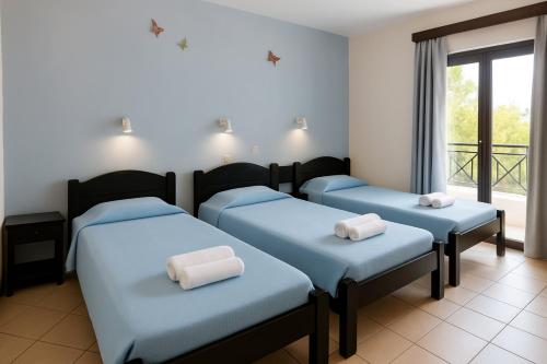 Postel nebo postele na pokoji v ubytování Royal Club Hotel - Aqua Poolside Bliss