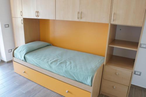 Postel nebo postele na pokoji v ubytování Appartamento Azalea Stresa