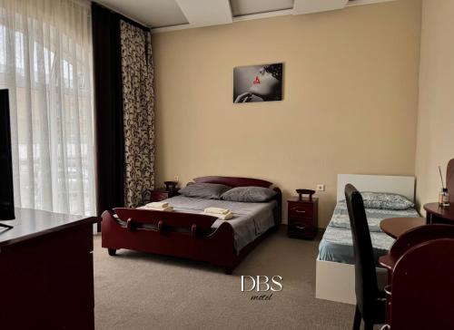 Una cama o camas en una habitación de DBS Hotel