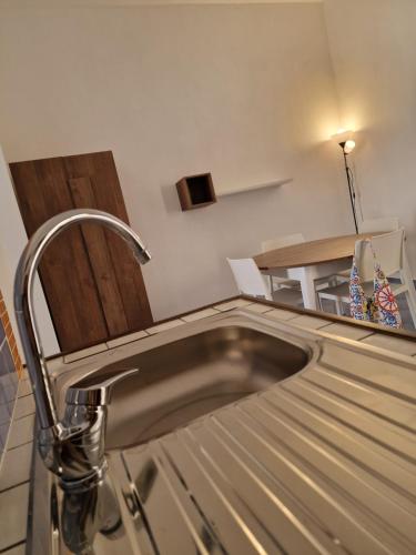 a kitchen with a sink and a counter at Giardino Mediterraneo in Trapani