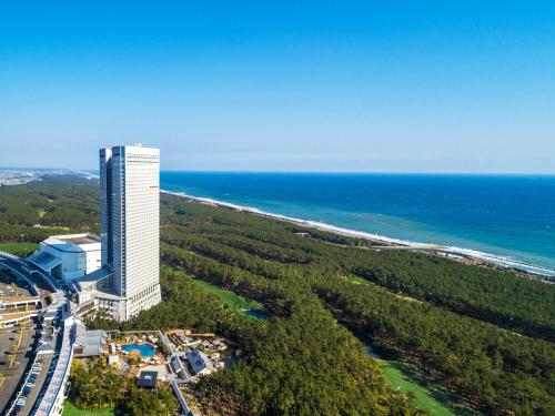 an aerial view of a building next to the ocean at Phoenix Seagaia Ocean Tower in Miyazaki