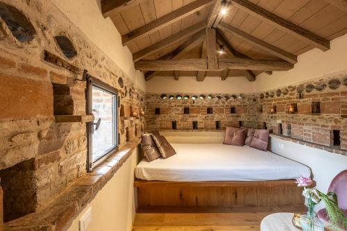 Postel nebo postele na pokoji v ubytování Relais Corte Baruzzo