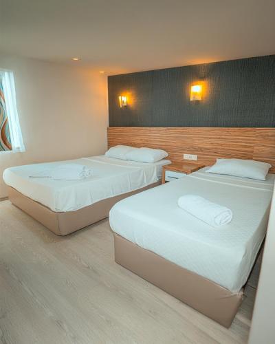 Ένα ή περισσότερα κρεβάτια σε δωμάτιο στο Yucesan Hotel