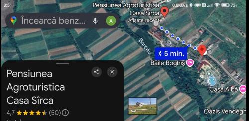 a screenshot of a cell phone with a map at Pensiunea agroturistica Casa Sirca in Boghiş