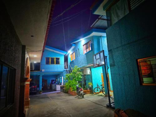 a blue building with a fire hydrant in front of it at El Rincón de Oaxaca - apartamento completo in Oaxaca City