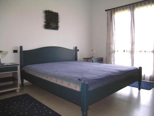 Una cama o camas en una habitación de Arcada