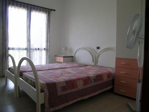Una cama o camas en una habitación de Arcada