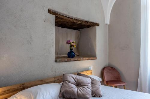 Postel nebo postele na pokoji v ubytování Relais Corte Baruzzo