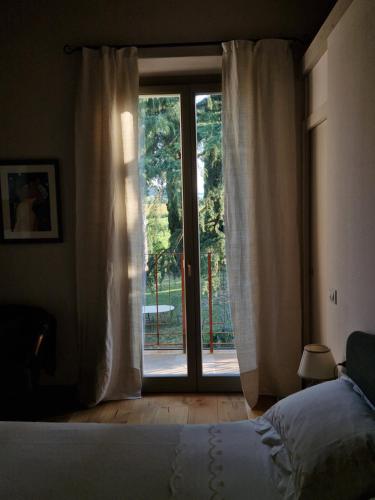 Katil atau katil-katil dalam bilik di Calicanto - Dimora nel parco