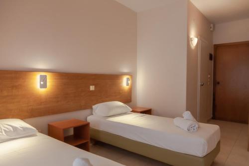 Ένα ή περισσότερα κρεβάτια σε δωμάτιο στο Fenix Apartments