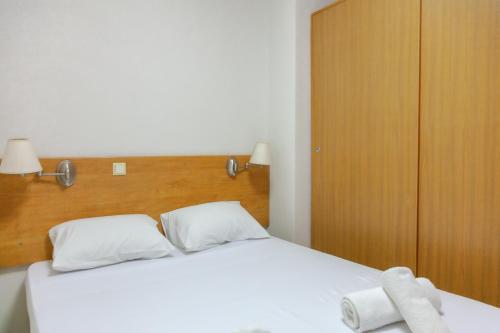 Ένα ή περισσότερα κρεβάτια σε δωμάτιο στο Fenix Apartments