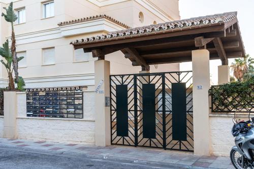 a gate in front of a building at Chill & Shine - Sun and Relax in Benalmádena
