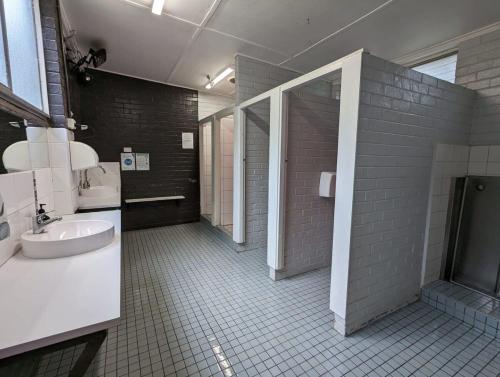a bathroom with a sink and a toilet in it at Tiny Homes Escape at Grampians Edge by Tiny Away in Dadswells Bridge
