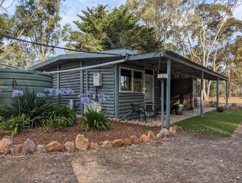 a tiny house with awning in a yard at Tiny Homes Escape at Grampians Edge by Tiny Away in Dadswells Bridge