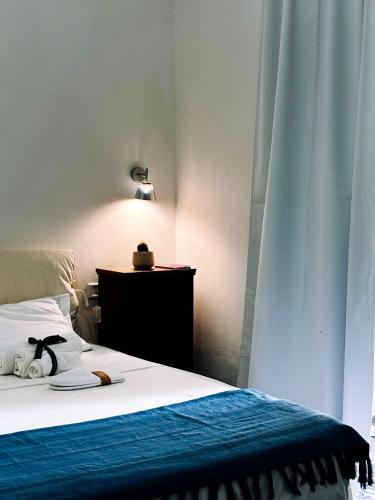 Postel nebo postele na pokoji v ubytování Giacaranda B&B