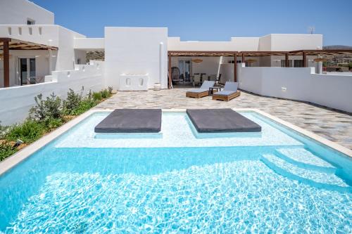 a swimming pool in the backyard of a villa at Depis private villas Plaka Naxos in Plaka