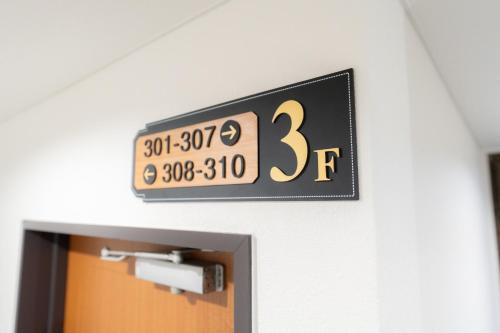 a clock on a wall above a door at Casa G,S, - Vacation STAY 53485v in Osaka