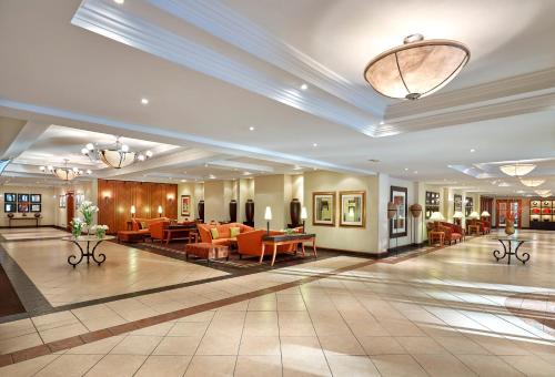 a lobby of a hotel with couches and tables at The Pamodzi Hotel in Lusaka