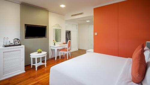 Postel nebo postele na pokoji v ubytování Memoire Siem Reap Hotel