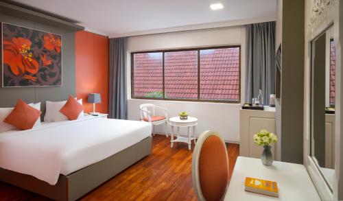Postel nebo postele na pokoji v ubytování Memoire Siem Reap Hotel