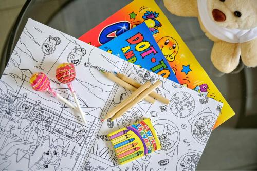 a table with a drawing and some pens and pencils at AC Hotel by Marriott Nice in Nice