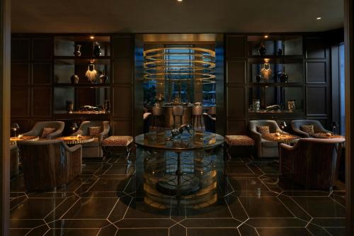 a lobby with a table and chairs in a room at The Ritz-Carlton Rabat, Dar Es Salam in Rabat