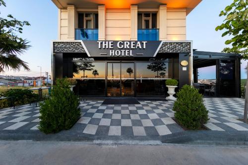 a hotel with a sign that reads the great hotel at The Great Airport Hotel in Arnavutköy