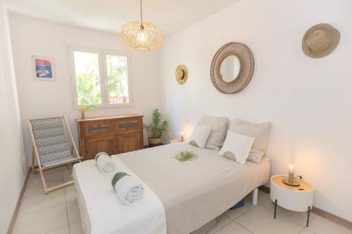Ένα ή περισσότερα κρεβάτια σε δωμάτιο στο Bel appartement 2 chambres, proche plage et commerces, 3ilets