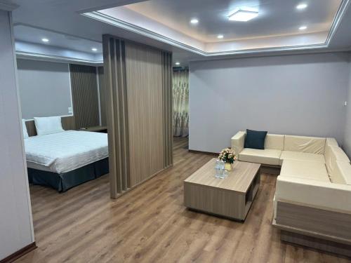 Ένα ή περισσότερα κρεβάτια σε δωμάτιο στο Mekong Hotel