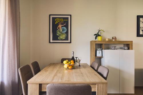 a dining room with a table and a refrigerator at Casa BRUGIDIO in Ossuccio