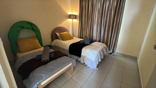 Ένα ή περισσότερα κρεβάτια σε δωμάτιο στο Humble Homestay Putrajaya