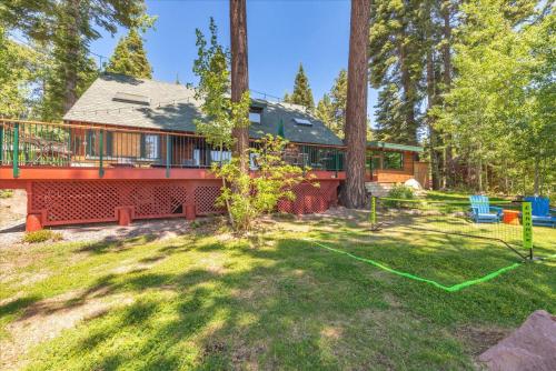 a house in the woods with a yard at JJs Lakeview Chalet in Tahoe Vista