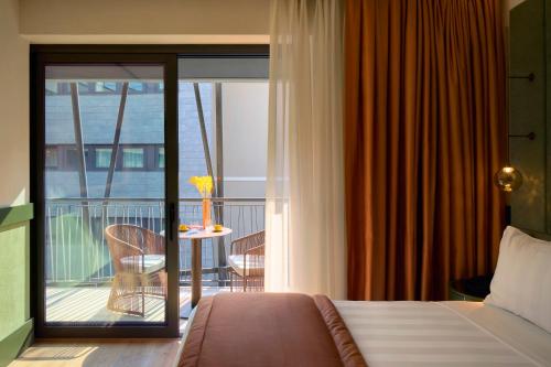 Postel nebo postele na pokoji v ubytování NEMI Hotel Milano