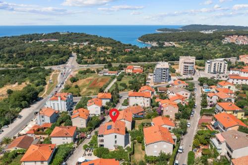 an aerial view of a town with orange roofs at room 1 in Pula