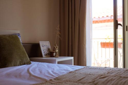 a bedroom with a bed and a window with a view at Casa Vacanze - Le Dimore Del Borgo Antico in Campomarino