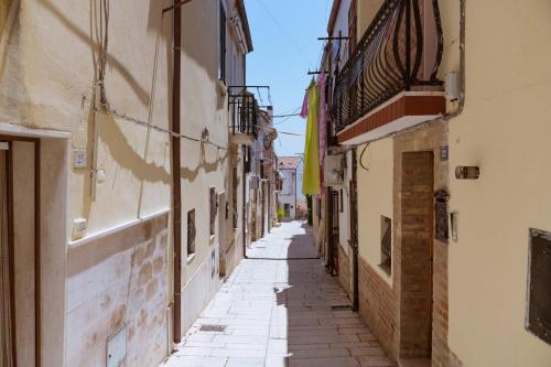 an alley in an old town with buildings at Casa Vacanze - Le Dimore Del Borgo Antico in Campomarino