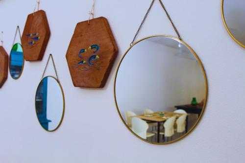 a mirror and other items on a wall at Medimare Residence Club in Patti