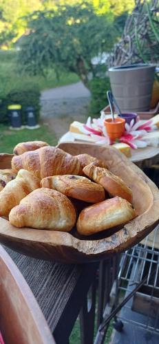 a plate of bread sitting on a table at Le Jardin D' Épicure in Oderen