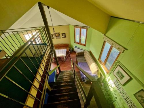a view of a room with a spiral staircase at Agroturystyka Stajnia Dorado Pokoje Gościnne i Apartamenty in Leoncin