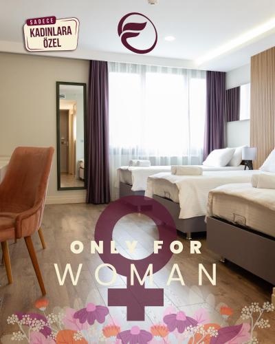 a hotel room with two beds and an on for man sign at Frezya - Exclusively Woman in Istanbul