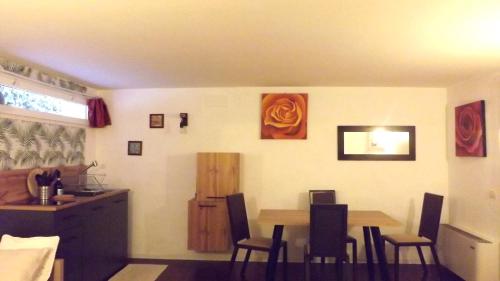 a kitchen and dining room with a table and chairs at Monolocale zona del prosecco in Moriago della Battaglia