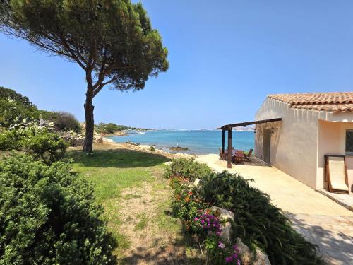 a house with a view of the ocean at Blue Eden La Maddalena in La Maddalena
