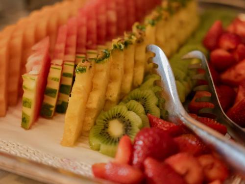 a platter of fruit and vegetables on a table at Hotel Bologna ***S in Verona
