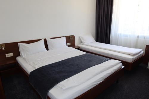 Cama o camas de una habitación en Gots - готельно-ресторанний комплекс
