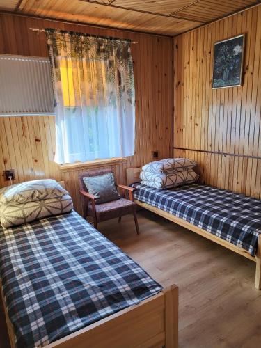 Postel nebo postele na pokoji v ubytování Malownicze Bieszczady - pokoje goscinne