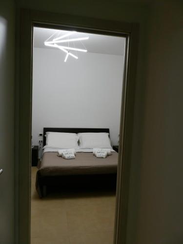 Ένα ή περισσότερα κρεβάτια σε δωμάτιο στο CV Bell'Aria - Appartamento Orchidea