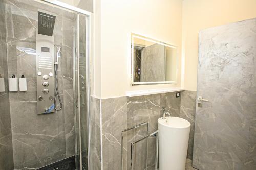 a bathroom with a shower and a sink at Hotel Torre Orefici in Genova