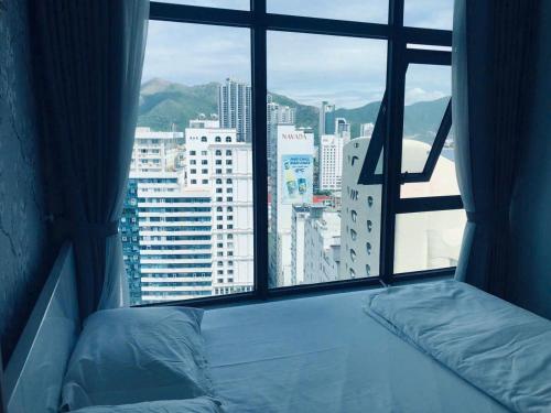 En eller flere senge i et værelse på ThanhTam homestay