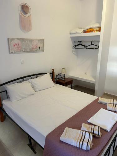 Ένα ή περισσότερα κρεβάτια σε δωμάτιο στο APOSTOLOS APARTMENT